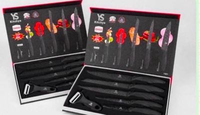 two sets of knives in a box with different designs on them