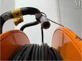 a close up of a hose and a hose holder