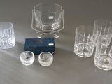 many glasses that are sitting on a table