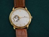 an image of a close up of a watch on a green cloth