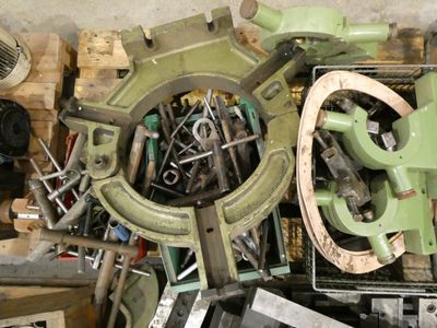 a pile of assorted tools sitting on top of a table