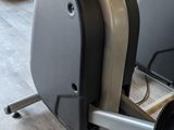 a row of stationary exercise bikes in a gym