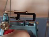 a close up of a sewing machine on a table