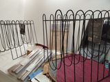 a wire rack that has a bunch of magazines in it