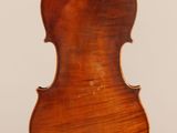 an old violin with a wooden back and a long neck