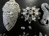 several pieces of jewelry are displayed on a black surface