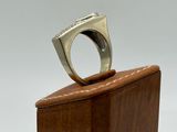sterling silver ring on wooden block