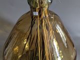 a glass vase with a bunch of dried flowers in it