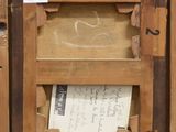 a picture of a wooden box with a letter inside of it