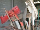 a bucket full of tools that are sitting on the floor