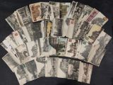 a lot of old postcards that are on the table