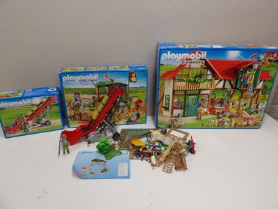 three playmobils on the table and one has a slide