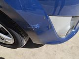 a close up of a car ' s front bumper with a dent on it
