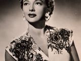 black and white photograph of a woman in a dress posing for a picture