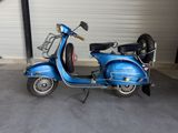 a scooter that is parked in a garage