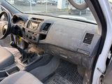 a dirty dashboard of a car in a parking lot