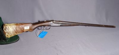an old gun with a green hat on a white background