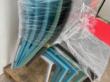 a stack of chairs that are wrapped up and ready to be used