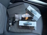a picture of a car seat with a bunch of items in it