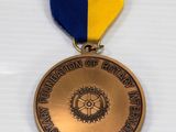 the medal is gold and blue with a gold ribbon around it
