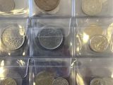 a lot of different coins in a plastic box