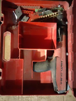 a red tool box with tools in it on the floor