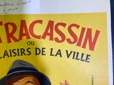 a poster of a man wearing a hat and a suit