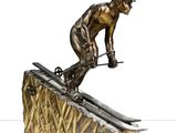 statue en bronze représentant un homme à skis au sommet d'une rampe