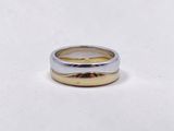 a close up of a ring on a white surface with a white background