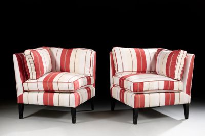 pair of red and white striped chairs against a black background
