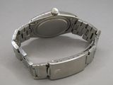 a close up of a wrist watch on a table