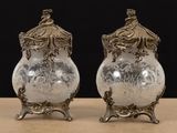 pair of antique silver plated vases on stand on table