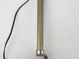 a close up of a metal object on a white surface