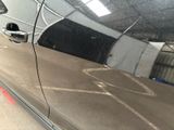 a reflection of a car on the side of the road