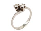 a close up of a diamond ring on a white background