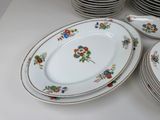 a lot of plates that are sitting on a table