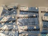 a pile of blue towels that are wrapped in plastic