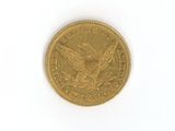 an image of a gold coin on a white surface