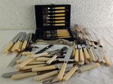 a lot of knives and knives that are on a table