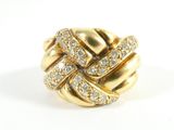 an image of a gold and diamond ring on a white surface