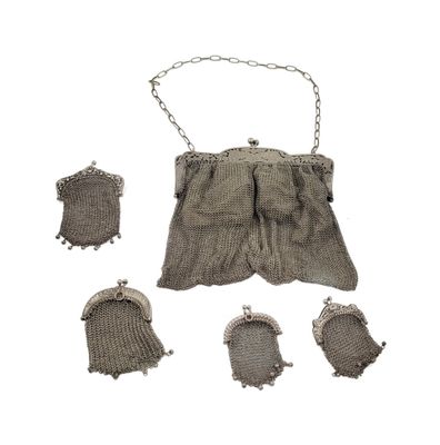 a small bag with a chain hanging from it