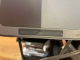 a close up of a laptop computer on a stand