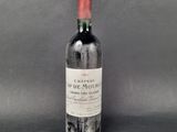 a bottle of wine sitting on top of a table