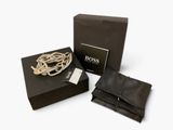 the box is open and has a bracelet in it