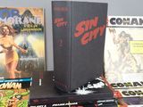 a lot of comic books sitting on a table