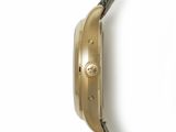 an image of a close up of a wrist watch on a white surface
