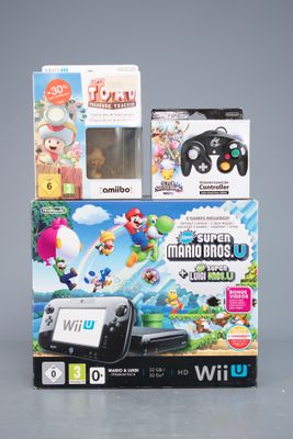 Deux jeux Nintendo Wii sont posés l'un à côté de l'autre sur une table