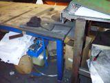 an image of a workbench that has a lot of clutter on it