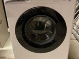 a washing machine that is sitting on the floor