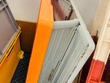 many crates and crates that are stacked together in a room